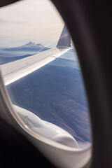 Fototapeta premium View of snow capped mount shasta from a commercial airliner