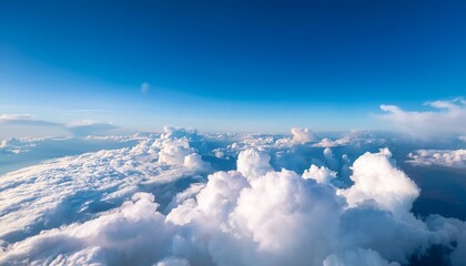 white clouds on blue sky background close up cumulus clouds high in azure skies beautiful aerial cloudscape view from above sunny heaven landscape bright cloudy sky view from airplane copy space