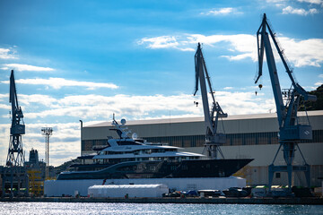 Mega Yacht Construction in Progress: Massive Luxury Vessel Docked at the Shipyard Harbor of Cartagena, Spain