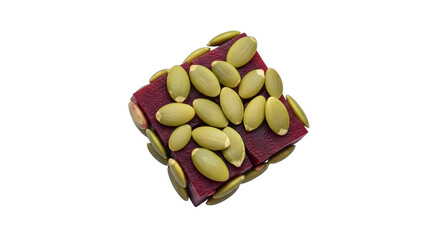 Closeup of a square piece of fruit leather topped with pumpkin seeds, isolated on transparent background