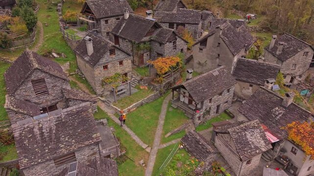 Swiss village Foroglio featuring old stone homes in vivid autumn landscape.