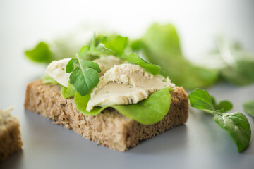 Close-up of a sandwich with herring and salad leaves