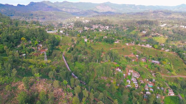 Peaceful Morning Journey as Train Travels Toward a Quiet Town in Mountain Landscape