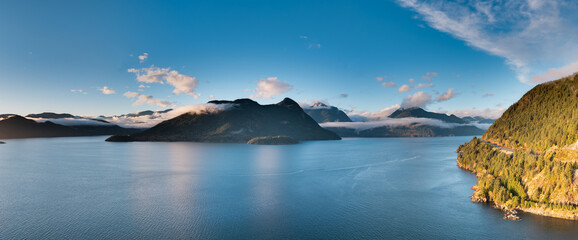 Scenic Panoramic Mountain Lake With Island Peaks Under Clear Blue Sky, BC Canada