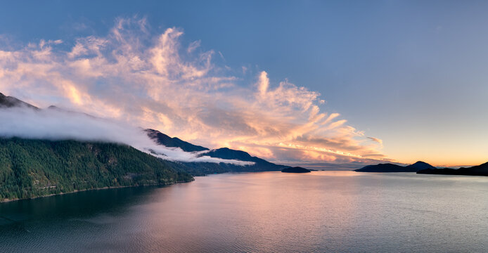 Sunset Over Coastal Mountains and Calm Water in British Columbia, Canada - Powered by Adobe