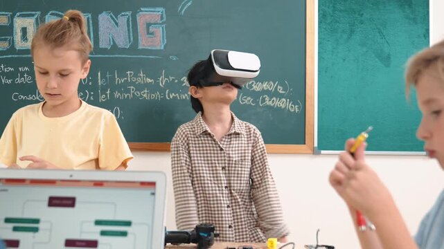 Energetic child wearing Vr headset while enter virtual world at classroom. Student programing system while generated AI to code engineering prompt software while boy fixing electronic board. Pedagogy.