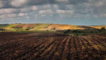 The Geometry of the Land A Farmhouse Nestled in the Hills