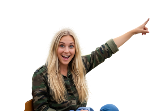 a surprised young woman with blonde hair pointing to the right wearing a camo shirt and jeans smiling and looking excited on transparent