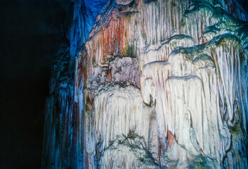 Colourful stalactite and stalagmite formations inside the Aven d'Orgnac cave in Ardèche, France