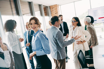 Professional team engaging in a collaborative office discussion showcasing teamwork, diversity, and...