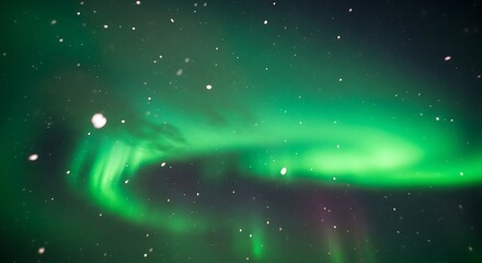 Vibrant green aurora borealis swirls across a dark night sky with falling snow northern lights stars