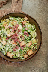 Brussels sprouts Caesar salad, with bacon and croutons, healthy food, homemade, no people,