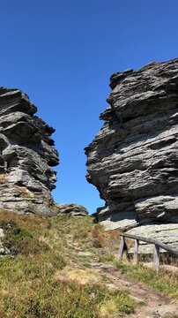 Vozka, Jeseniky mountains, Czech Republic, Czechia. Rock and stone in the nature. Summertime hill and mountain landscape with clear blue sky. Panning vertical video	