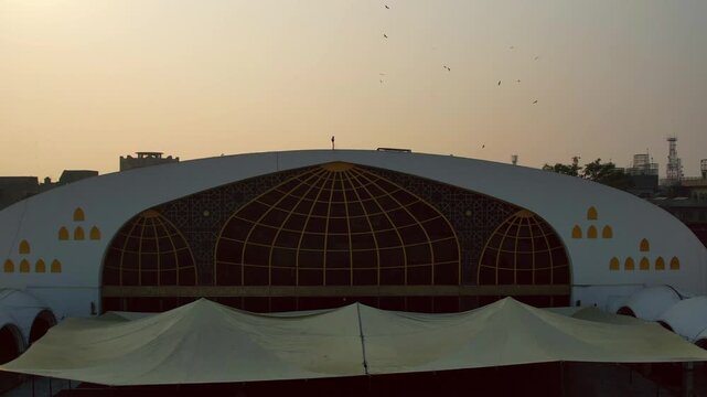 Lahore, Pakistan - 29 July 2025: Aerial view of the Data Darbar Road area, with its buildings under a golden sky, creating a captivating urban landscape.