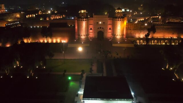 Aerial view of the illuminated lahore Fort radiates a warm glow against the dark night sky, lahore, Punjab, Pakistan.