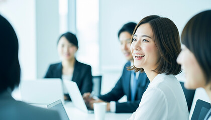 Obraz premium A female business professional laughing during a meeting