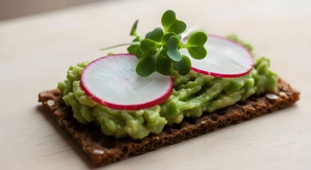 Organic rye crispbread close-up with avocado spread for healthy open-faced appetizer and rustic lifestyle design