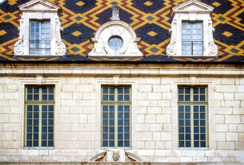 Roof with mosaic ceramic tiles in Burgundy, France