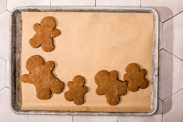 Gingerbread people cookies on parchment paper
