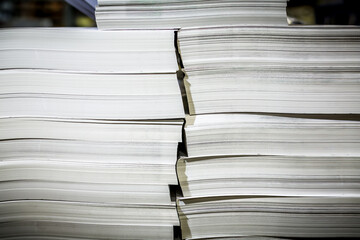 Close-up of stacked white paper reams, aligned and untouched—perfect for printing, publishing, or office use.