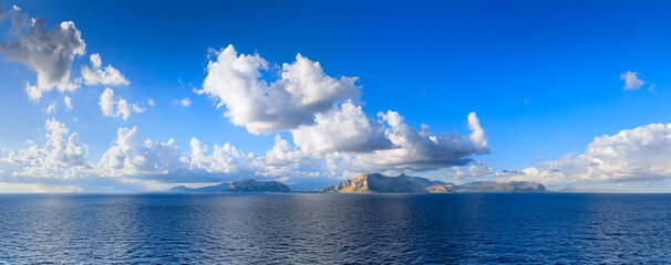 Panoramic view from the sea of ​​the Sicilian coast near Palermo, southern Italy: the Capo Gallo Nature Reserve in the center.