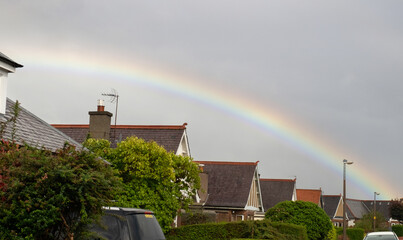 Rainbow adds colour to a drab housing estate in Morningside, Edinburgh, Scotland