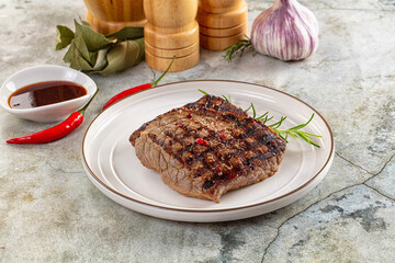 Grilled juicy beef steak with pepper