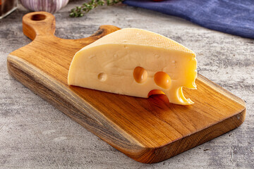 Yellow maasdam cheese triangle piece