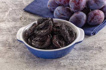 Black dry sweet prunes heap