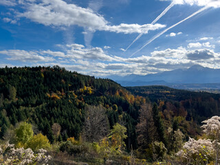 View of green Austrian Alps in autumn with blue sky
