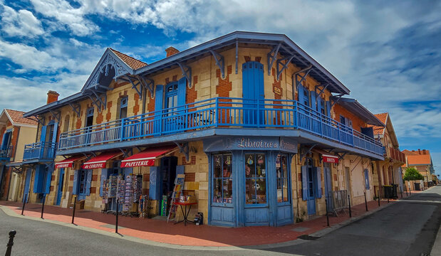 Soulac sur Mer, France - June 06, 2025. View of a vintage bookstore Librairie de Corinne in the background of the blue sky.