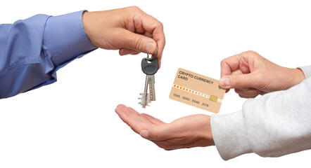 New homeowner receiving keys with cryptocurrency card during real estate transaction