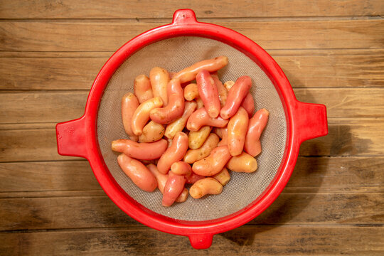Ulluco tubers in a colander. Fresh Andean ullucos (olluco), a traditional South American tuber.