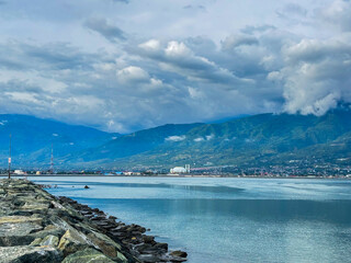 Discover the tranquil beauty palu city mountains and serene waters in this stunning landscape vista
