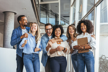 Diverse Group Of Friends And Colleagues Celebrating Together In Bright Modern Office