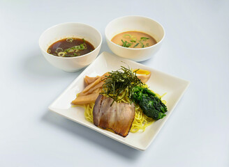 chilled zaru ramen, a refreshing twist on a classic. Featuring savory pork, vibrant greens, and flavorful dipping sauces for a satisfying meal.