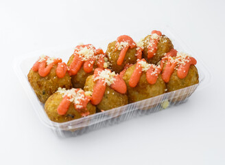 takoyaki balls topped with Spicy Pollack Roe, flavorful sauce and cheese, perfect for a quick meal or snack. A delicious taste of Japanese cuisine.