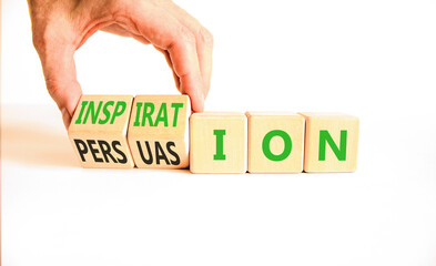 Persuasion or inspiration symbol. Concept words Persuasion and Inspiration on wooden cubes. Beautiful white background. Psychologist hand. Psychology persuasion inspiration concept. Copy space.