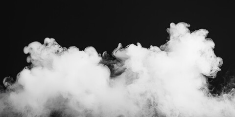 Naklejka premium A wispy cloud of white smoke on a dark background, creating an ethereal and dramatic visual effect.