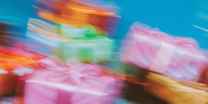 Colorful wrapped gifts in various sizes and shapes, creating a festive atmosphere. The background is a soft blue, enhancing the holiday spirit.