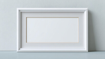 Empty white frame on a light gray wall showcasing modern design