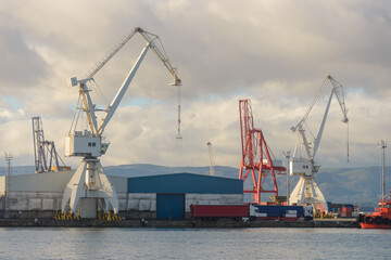 Obraz premium Port crane in a seaport, cargo transportation
