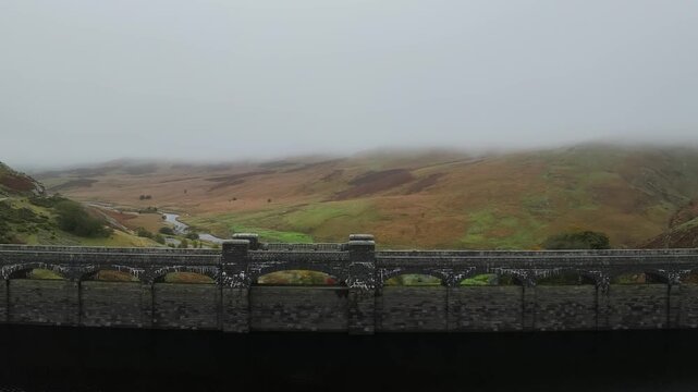Autumn over Craig Goch Dam from a drone, Elan Valley Reservoirs, Elan Valley, Rhayader, Powys, Wales