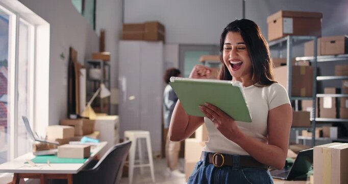 Excited, woman or surprise with tablet in logistics for sales increase, bulk order or client review. Staff, small business owner and fist pump with tech in warehouse for shipping deal and good news