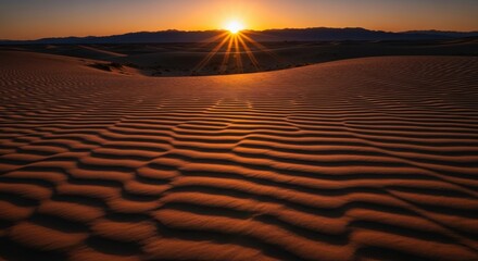 Golden hour sunburst over rippled sand dunes in a vast desert landscape