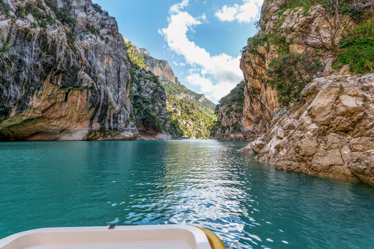 Boat trip on turquoise water of mountain canyon, Verdon Gorge in french Alps, Provence France.