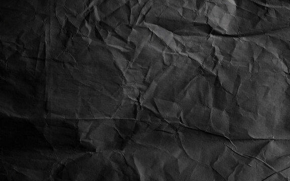 Black Crumpled relief craft paper blank texture copy space background. - Powered by Adobe