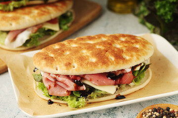 Panini sandwich with prosciutto in Italian style	