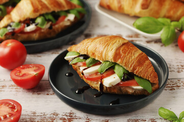 Croissants with mozarella cheese and tomatoes in caprese style