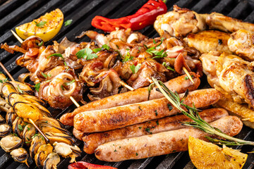 Mixed grilled meat and seafood assortment on barbecue